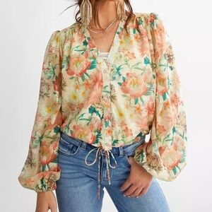 a.peach Coral and cream color blouse with button down front